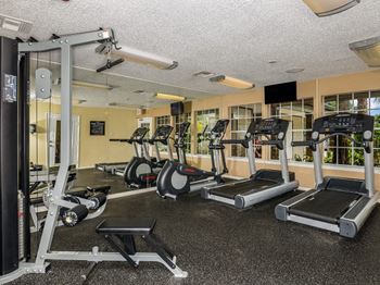 Fully Equipped 24-Hour Fitness Center with Stretching Room